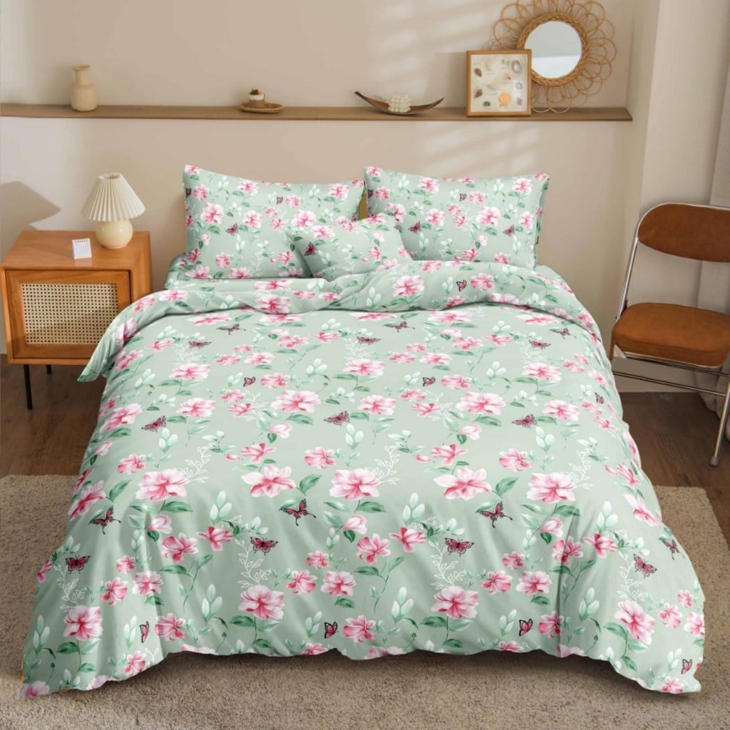 Green Floral Bedsheet pink florals and butterflies on sage green print on bed