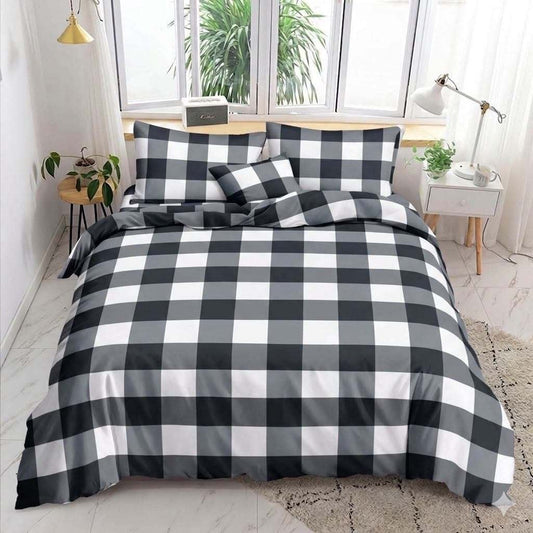Black Tiles Bedsheet black white and gray checkered print on bed