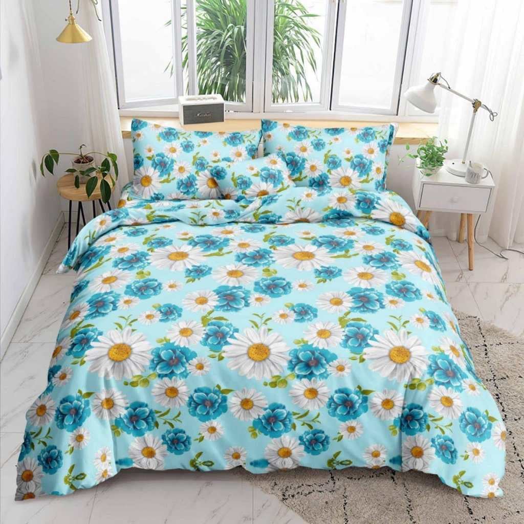 Daisy Bedsheet white daisies and teal florals on blue print on bed