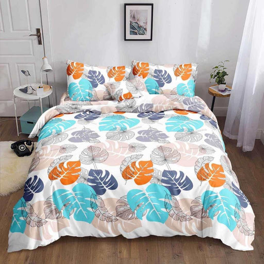 Light Monstera Bedsheet turquoise orange and navy monstera print on bed