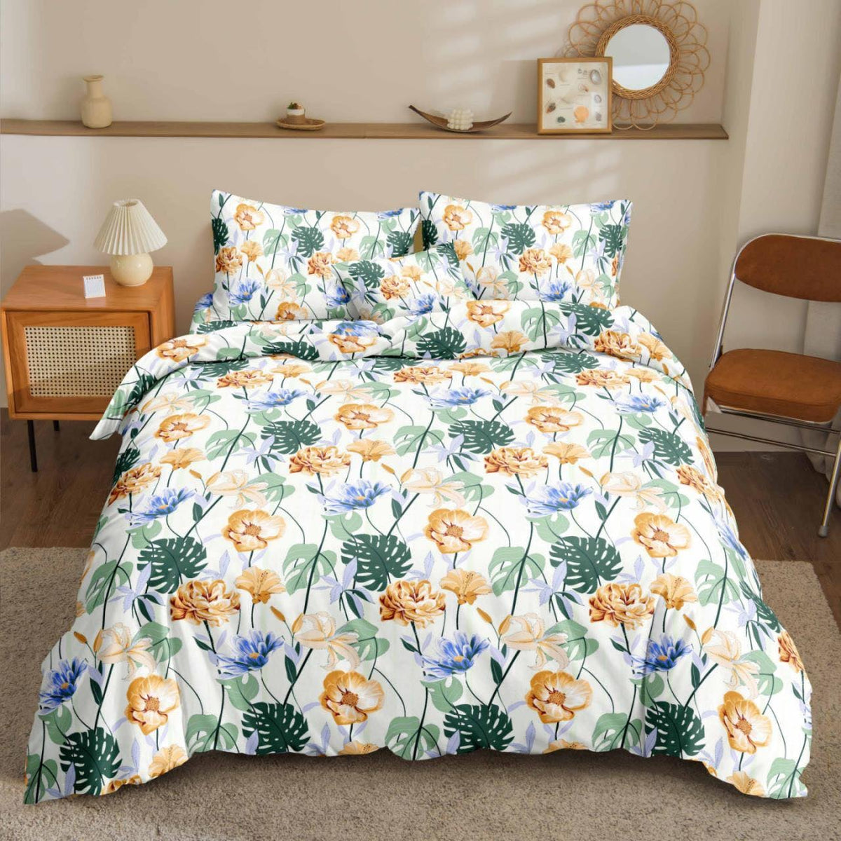 Mons Floral Bedsheet gold and blue florals with monstera leaves print on bed