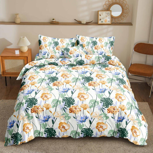 Mons Floral Bedsheet gold and blue florals with monstera leaves print on bed