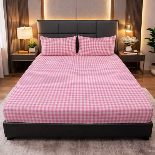 Pink Checkered Bedsheet pink and white checkered print on bed